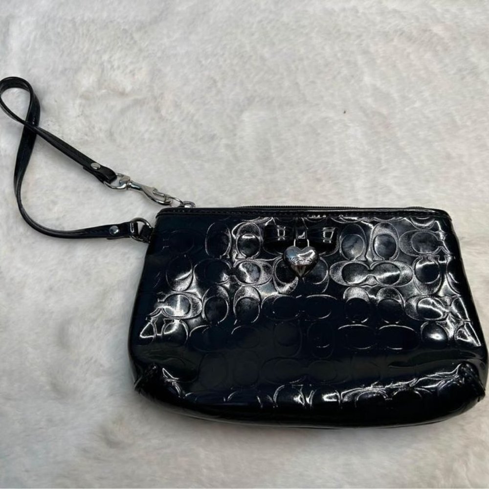 COACH woman’s black bow wristlet. Classic logo design. Wrist strap. New conditio